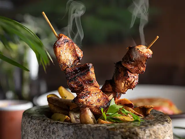 Grilled alpaca brichera with fig reduction